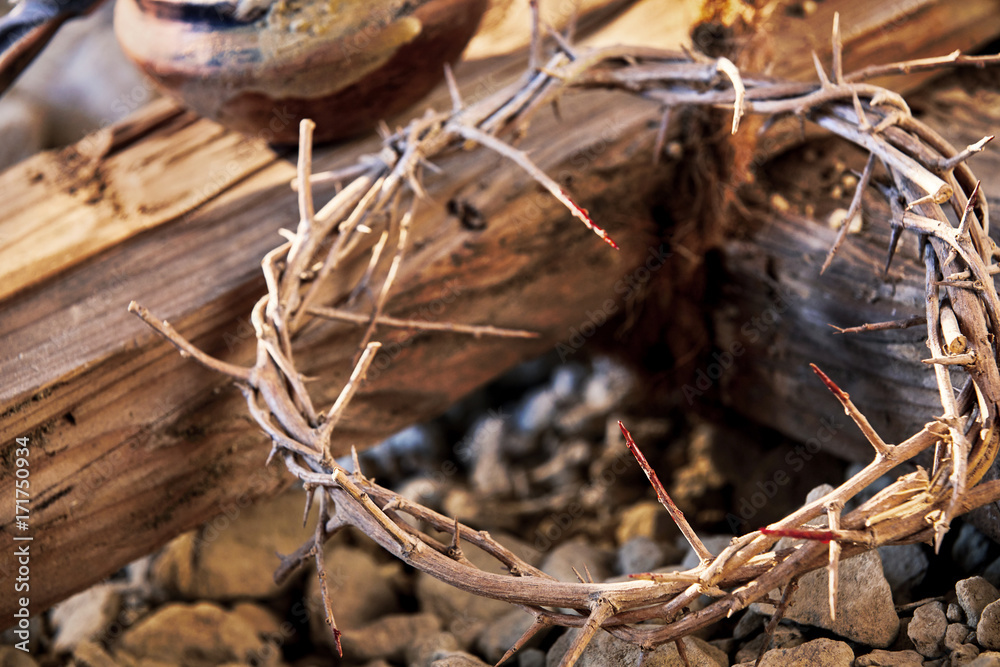 Bloodstained crown of thorns on a wooden cross Bloodstained crown of thorns on a wooden cross