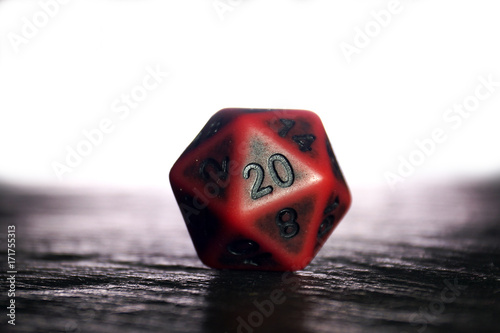 A polyhedral twenty sided die used for role playing games such as Dungeons & Dragons.