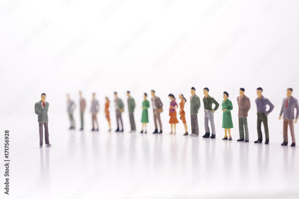 Miniature people, boss against the line of people over white background.