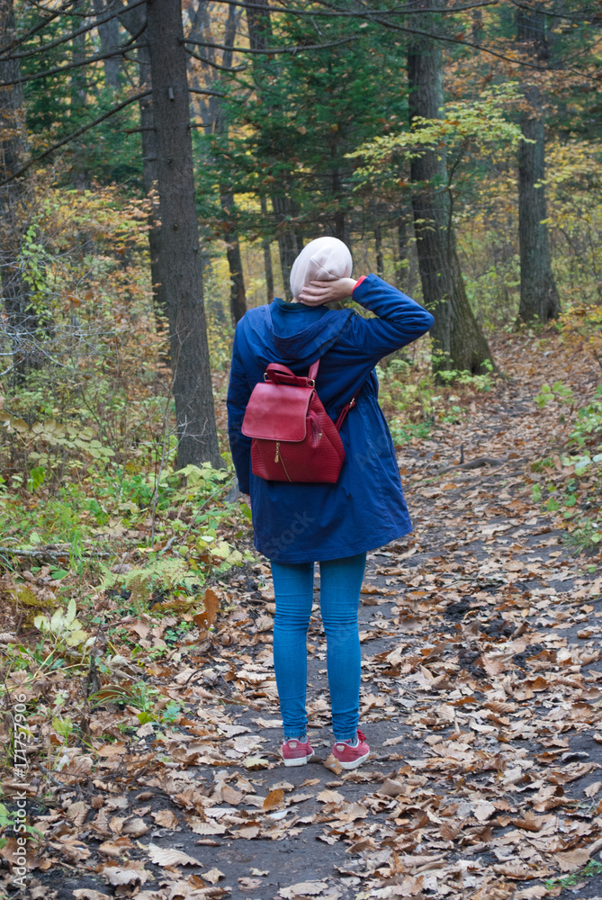The girl in the autumn forest walks The girl in the autumn forest walks