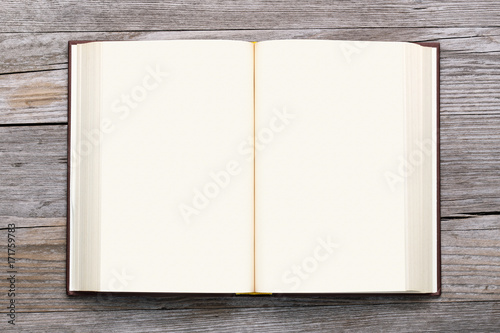 blank book open on old wooden background