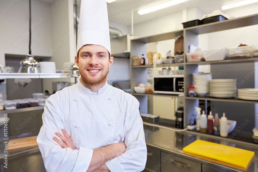 happy male chef cook at restaurant kitchen