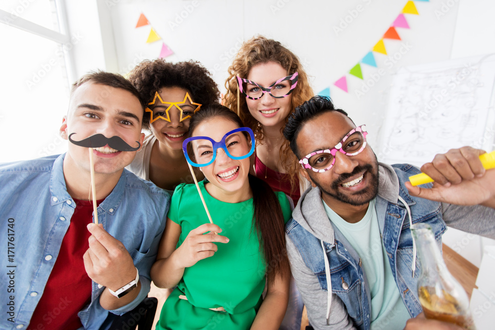 © Syda Productions - happy friends or team having fun at office party