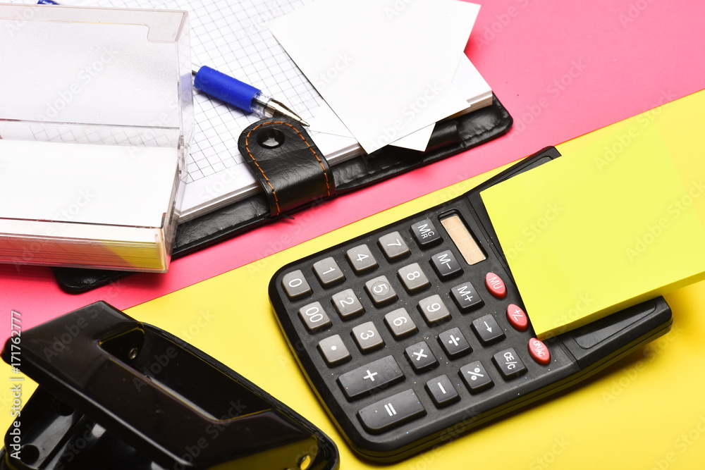 Open notebook with blank pages, leather covered and calculator Open notebook with blank pages, leather covered and calculator