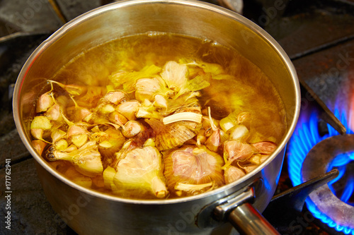 Garlic boiling soup in a pan
