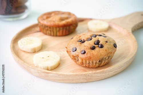Homemade Banana cupcake on wooden plate with white background,selective focus