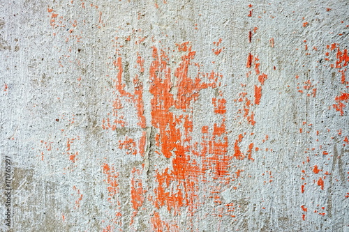 Red Peeling Paint on Concrete Wall Background.
