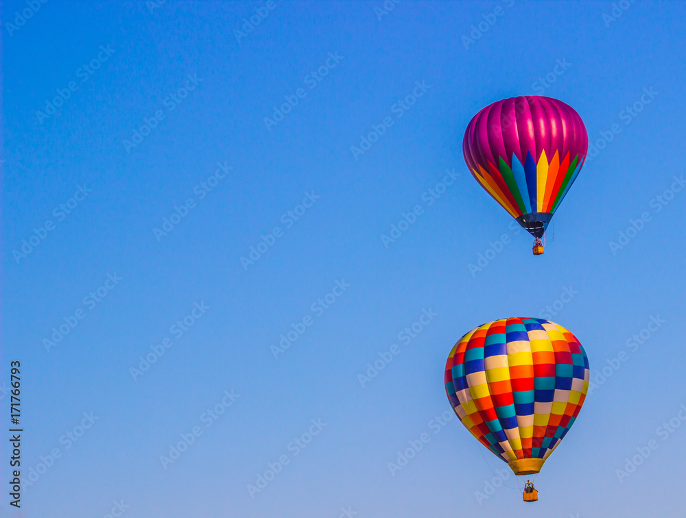 Two Multi Colored Hot Air Balloons In Early Morning Two Multi Colored Hot Air Balloons In Early Morning