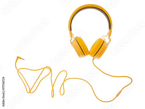 yellow headphones or earphone computer isolated on a white background photo