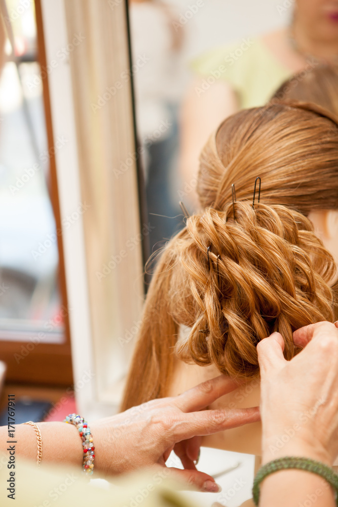 Fototapeta premium Working in the salon on a new hairstyle. Beauty and fashion