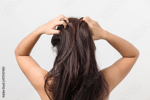 Asian young women itching scalp ,itchy his hair