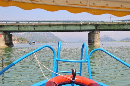 On an excursion boat on lake skadar, Montenegro. Approaching the only bridge over the lake, near Virpazar. Southeast Europe.  photo