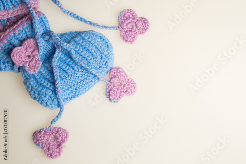 Handmade knitting baby booties isolated on white