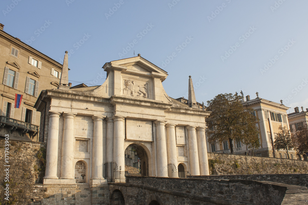 Bergamo - Old city (Citta Alta). One of the beautiful city in Italy. Lombardia. Landscape on the old gate named Porta San Giacomo during a wonderful blu day