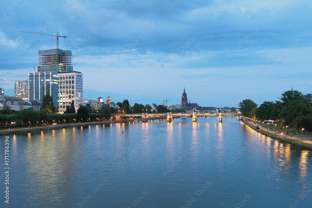 Naklejka premium River, bridge and city in evening. Frankfurt am Main, Germany