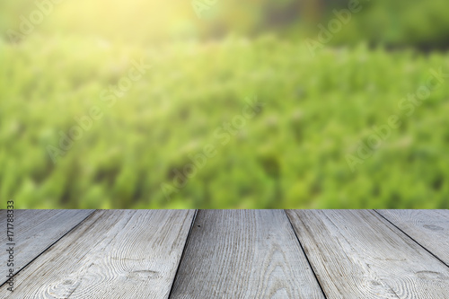 Blurred nature background and gray wooden planks  floor or table