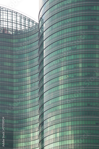 High-rise buildings that are equipped with glass throughout the building.