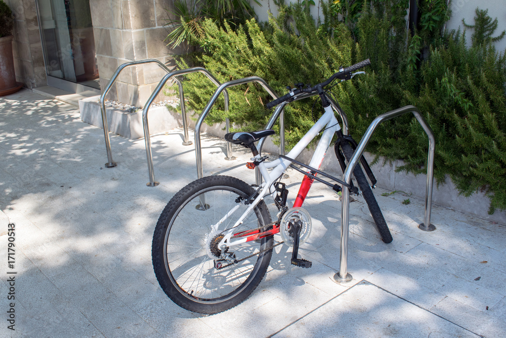 Fototapeta premium Locked bicycle at bicycle parking