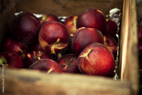 wood crate of fresh peaches