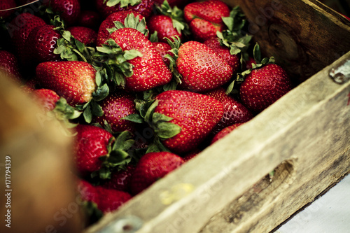 wood crate full of strawberries