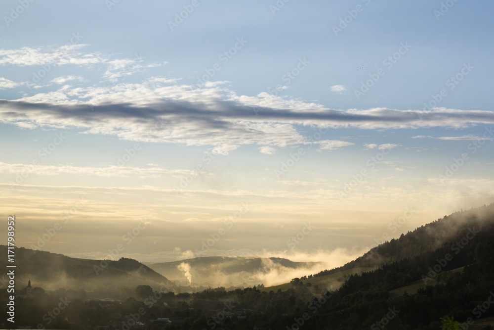 Obraz premium Misty morning sunrise on the road. Slovakia