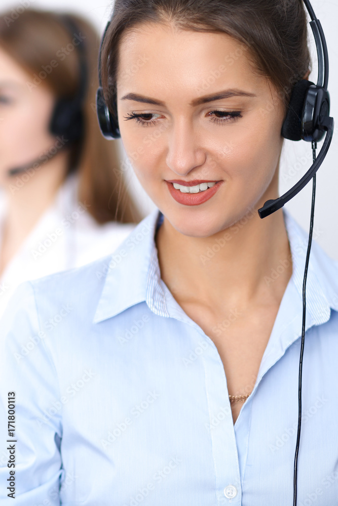 Call center. Focus on beautiful business woman in headset Call center. Focus on beautiful business woman in headset