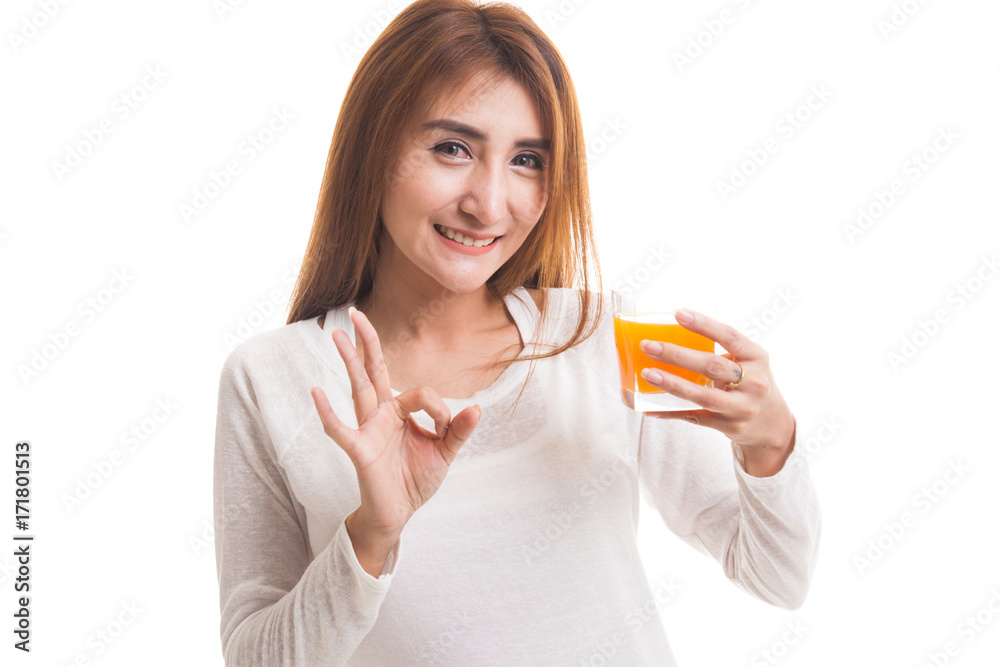 Young Asian woman show OK drink orange juice. Young Asian woman show OK drink orange juice.