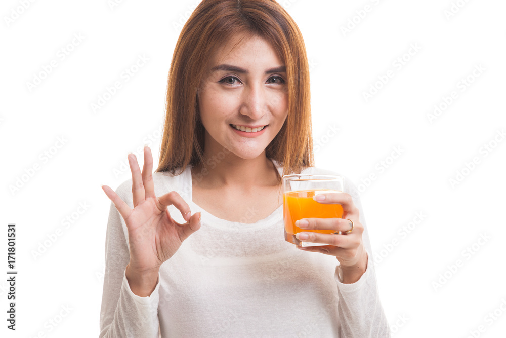Young Asian woman drink orange juice show OK sign. Young Asian woman drink orange juice show OK sign.