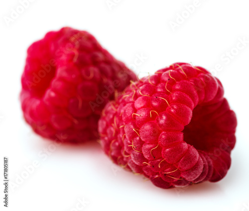 Close-up Two raspberry berries on a white background.