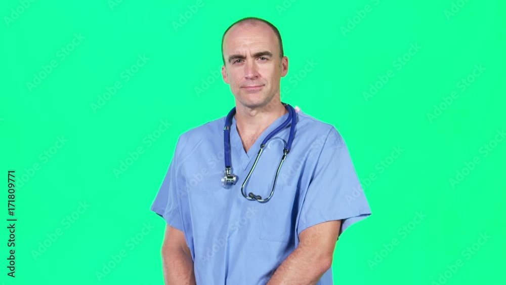Green screen chromakey portrait of surgeon doctor, arms folded with a confident, serious expression. ProRes clip, shot in 4K UHD. Green screen chromakey portrait of surgeon doctor, arms folded with a confident, serious expression. ProRes clip, shot in 4K UHD.