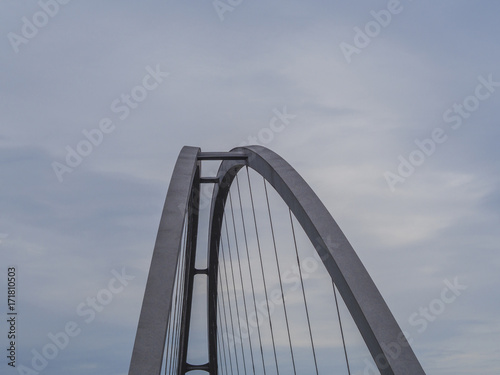 top of the steel suspension bridge arch with blue sky background © Kristyna