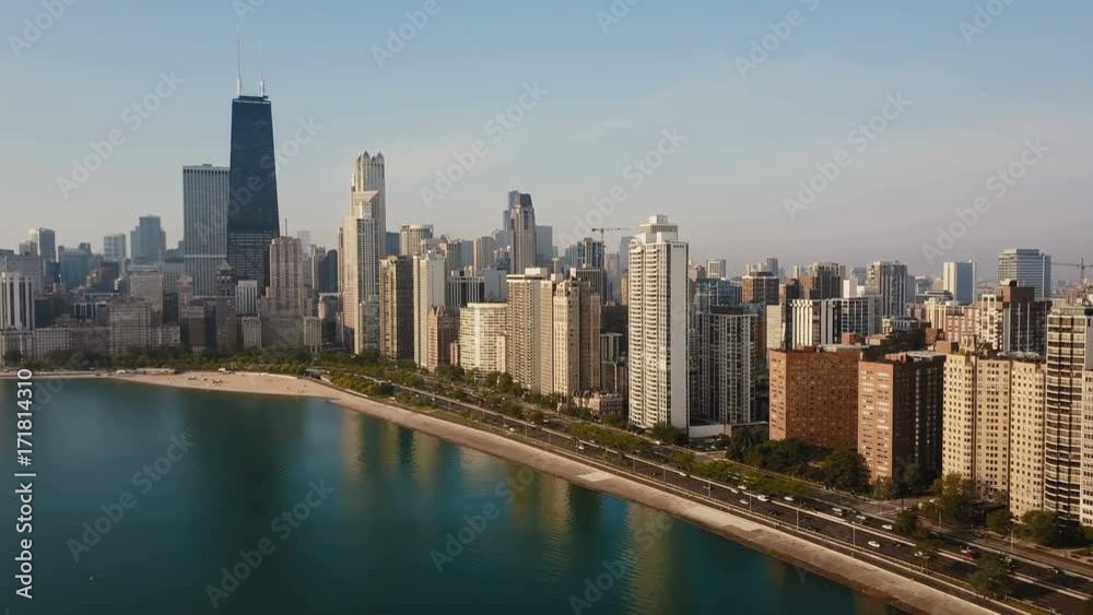 Beautiful aerial view of the Chicago, America in the morning. Drone flying away from the downtown, Michigan lake. Beautiful aerial view of the Chicago, America in the morning. Drone flying away from the downtown, Michigan lake.