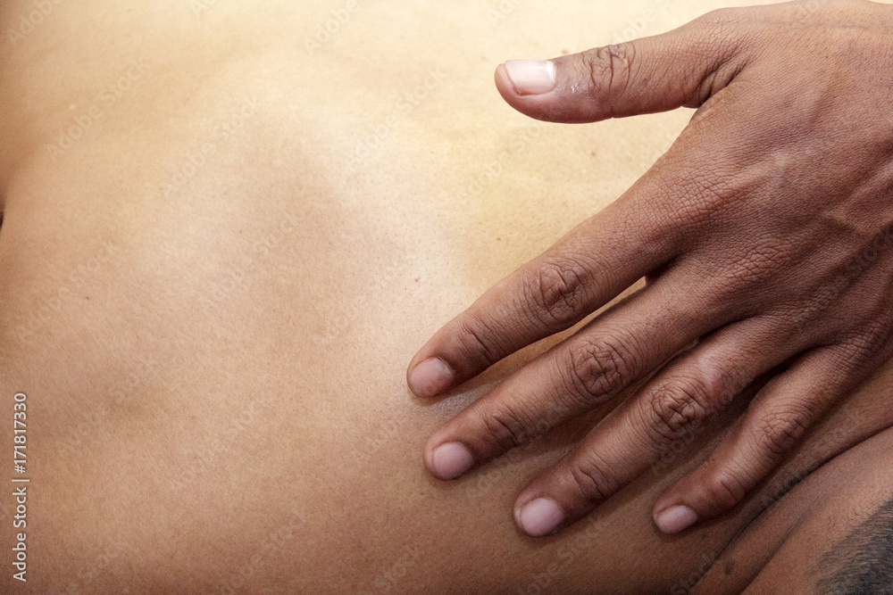 sport massage - men's hands are doing sport massage on the part of the human body