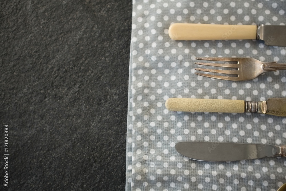 High angle view of cutlery on napkin High angle view of cutlery on napkin