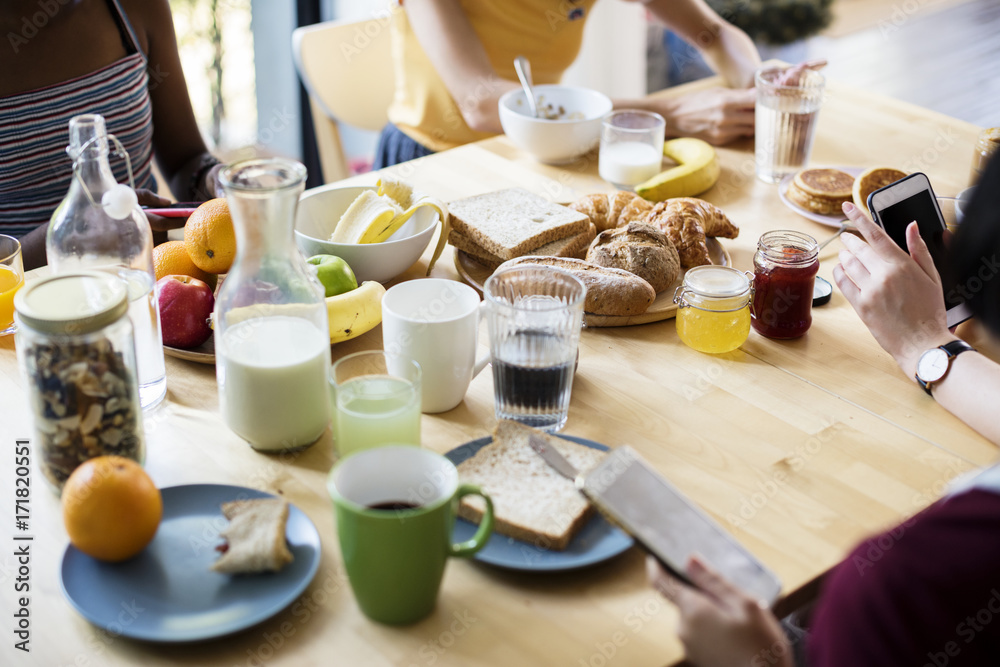 Group of diverse women having breakfast together Group of diverse women having breakfast together