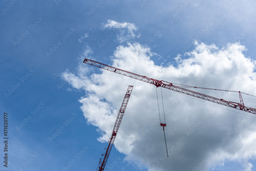 two red cranes in blue sky two red cranes in blue sky