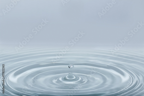 Water droplets higher on the surface with soft white background