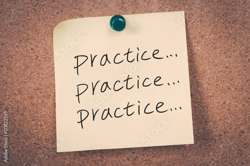 practice concept reminder message on a cork board photo