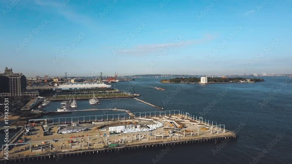 Aerial view of the shore of East river in New York, America. Drone flying along the building on the coast in Brooklyn. Aerial view of the shore of East river in New York, America. Drone flying along the building on the coast in Brooklyn.