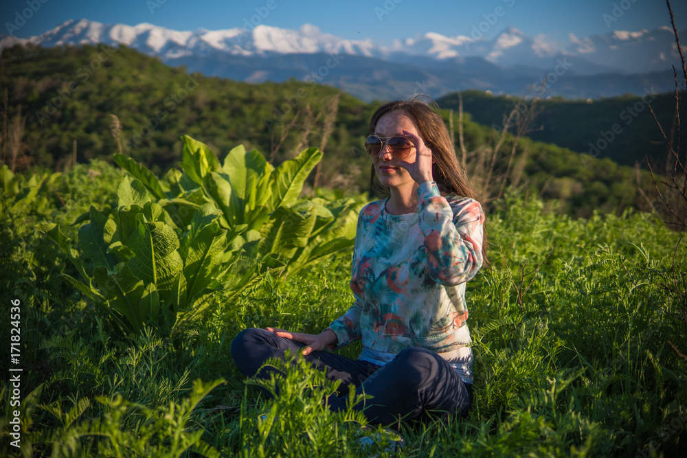 Pretty young woman in mountains on sunset time. Pretty young woman in mountains on sunset time.