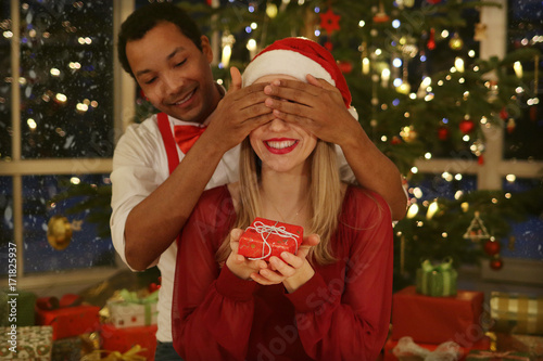 Couple opening christmas presents