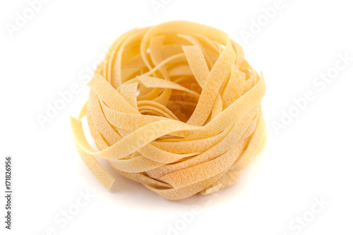 Italian pasta fettuccine nest isolated on white background