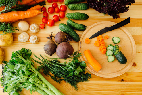 Vegetable on the wooden table in the kitchen, top view photo