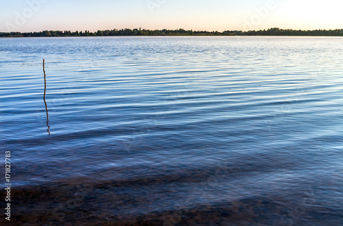 rural landscape with river and blue sky