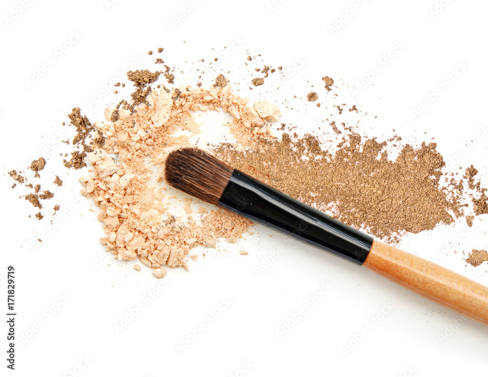 Brush and eyeshadow isolated on white background