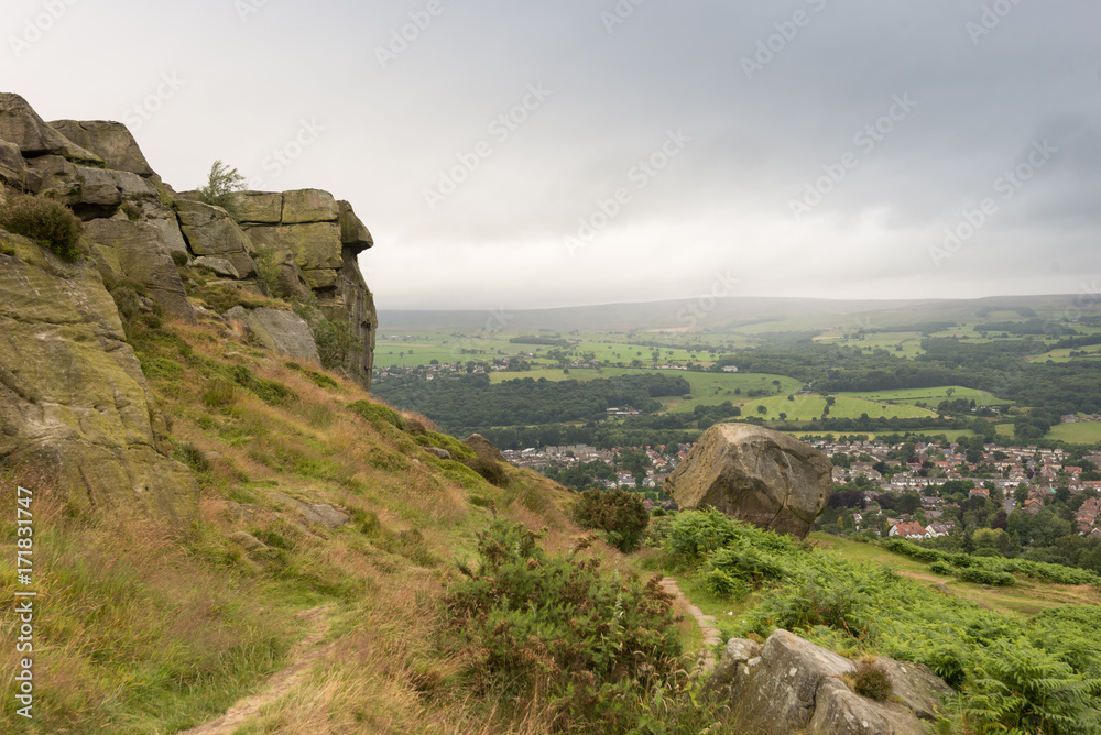 Cow and Calf overlooking township of Ilkley in Yorkshire