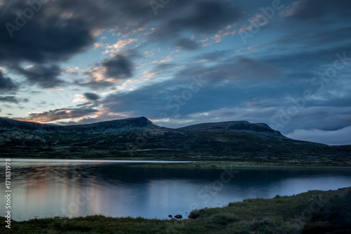 Clouds reflecting on a lake at sunset in the Rondane National Park in Norway - 3 © gdefilip