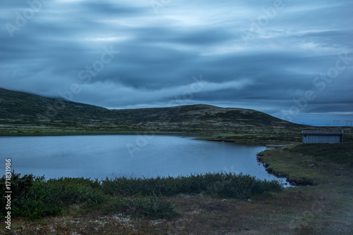 Clouds reflecting on a lake at sunset in the Rondane National Park in Norway - 5