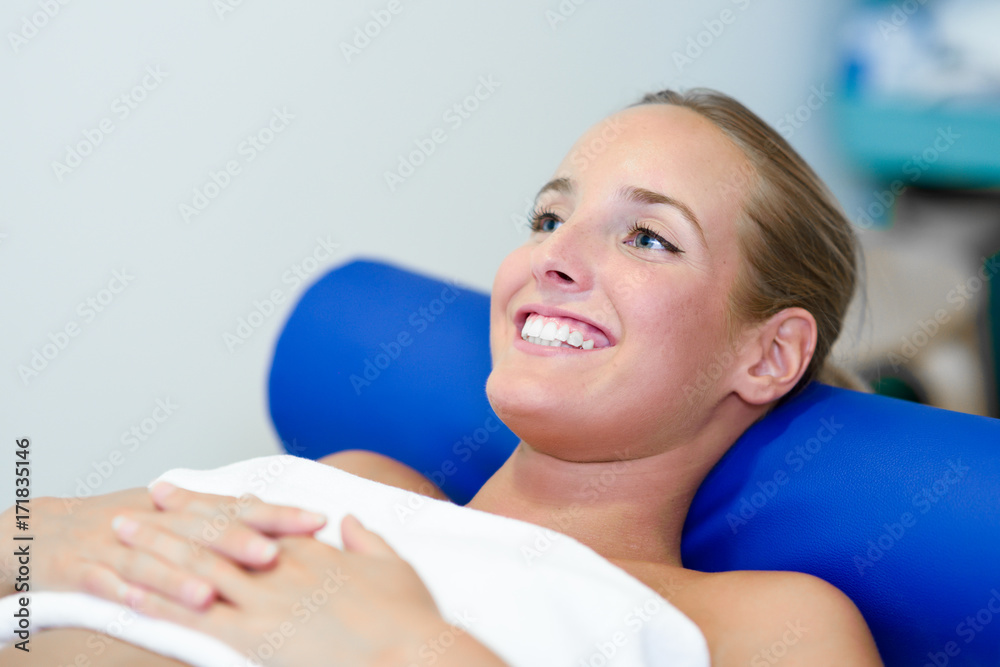 Young female patient on bed in a physiotherapy center. Young female patient on bed in a physiotherapy center.