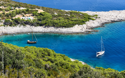 View from above on two sailing boats in a beautiful blue bay in Croatia